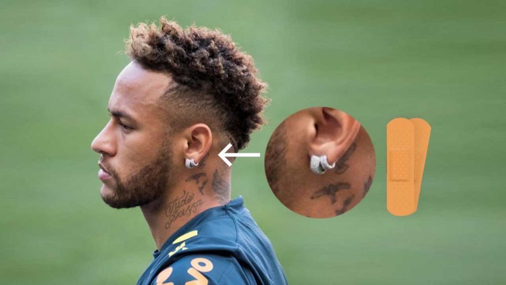can soccer players wear earrings covered with tape